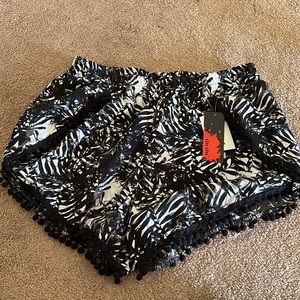 Brand new shorts, perfect to wear over bathing suit!